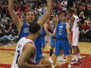 Brandon Row attempts to inbounds while being guarded by Dirk Nowitzki during the first round of the 2011 playoffs.
